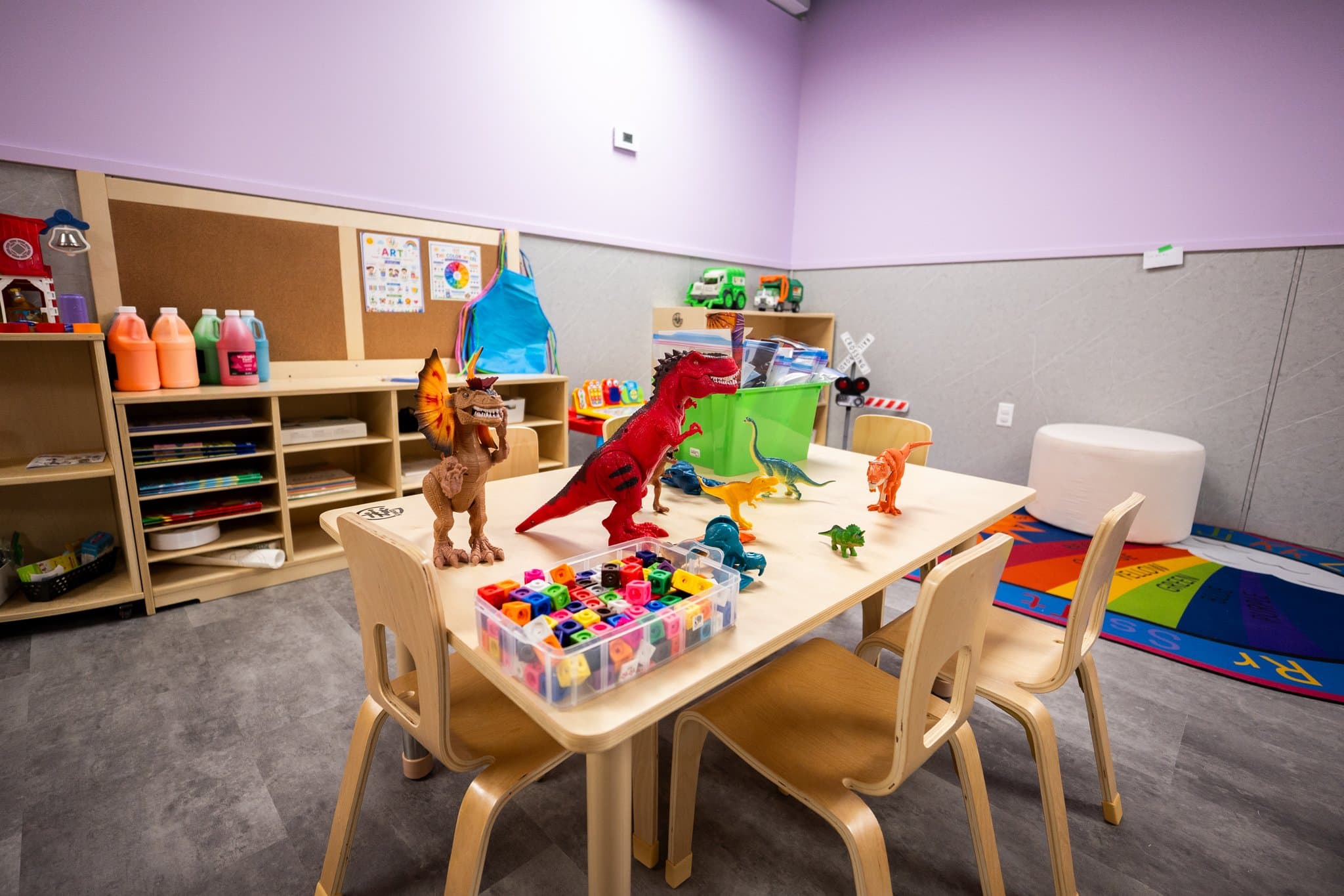 Preschool art tables with creative supplies and craft stations